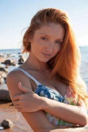Hot redhead Michelle H flaunting her big tits & tight pussy on the beach on fanspics.com