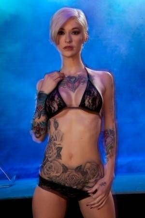 Hot tattooed Kleio Valentien sheds black lace panties to squat & spread legs on fanspics.com