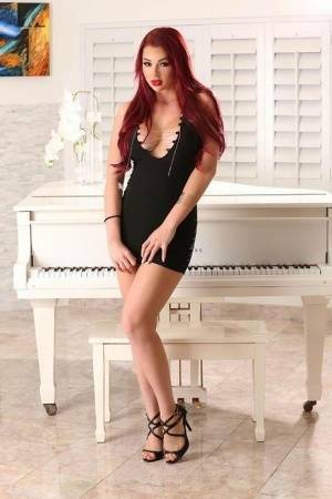 Hot redhead Skyla Novea sucks and tit fucks her man's long cock on fanspics.com