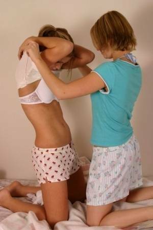 Young amateur Karen & Amy enjoy undressing each other & kissing in underwear on fanspics.com