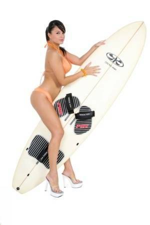 Sexy surfer girl Sarah peels off her bikini to model naked on her board on fanspics.com