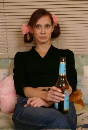 Young redhead chugs a beer before having sex with an older man on fanspics.com