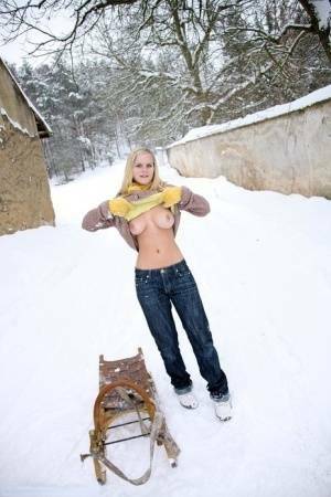 Busty blonde bares big tits in the snow & sucks POV for mouthful of cum on fanspics.com