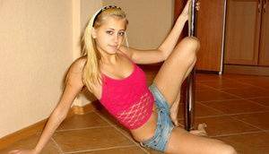 This blonde cover chick have a great wild posing on the floor on fanspics.com