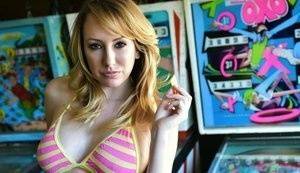 Brett Rossi fingers her pussy in striped OTK socks atop pinball machine on fanspics.com