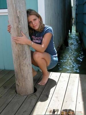 Blonde solo girl flashes upskirt panties on lakeside boardwalk on fanspics.com