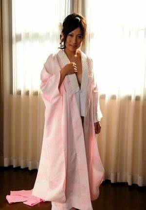 Japanese solo girl slips off her robe to reveal her nice boobs in white socks - Japan on fanspics.com