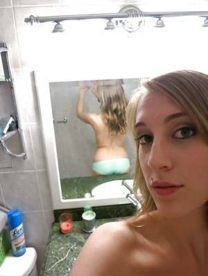 Smiley amateur Cadence Lux stripping and picturing herself in the bath on fanspics.com