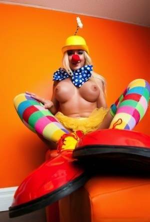 Hot cosplay MILF Leya Falcon in clown costume fondling her huge big tits on fanspics.com