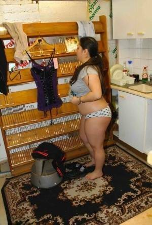 Fat amateur Kimberly Scott changes into lingerie inside a XXX store on fanspics.com