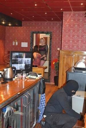 Amateur chick Kimberly Scott and a girlfriend disrobe a hooded male robber on fanspics.com