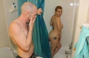 Naked girl Nadia White pleasures her guy's cock while taking a shower on fanspics.com