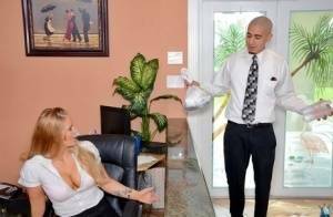 Clothed office worker unveiling big tits while fucking co-worker on fanspics.com