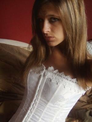 Teen in white corset and tight panties showing off her perfect tight body on fanspics.com