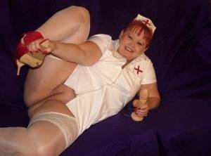 Mature redheaded nurse Valgasmic Exposed exposes herself during dildo play on fanspics.com