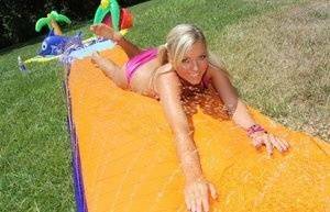 Young blonde Ally Kay ends a water fight by having sex in backyard on fanspics.com