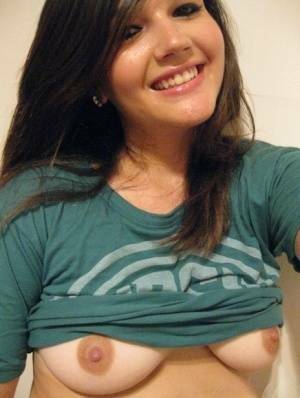 Cutie Veronica takes a slef shot of her nice big tits and firm round ass on fanspics.com