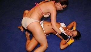 Adorable lesbians are into hot nude wrestling in the ring on fanspics.com