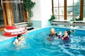 Playful fetish ladies have some fully clothed fun in the pool on fanspics.com