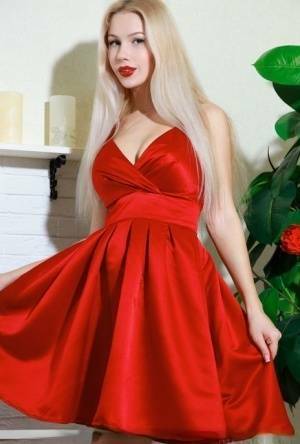 Nice blonde teen Genevieve Gandi removes red dress to display her trimmed muff on fanspics.com