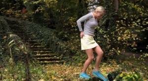 Cute blonde Victoria Pure hikes her skirt to take a pee along country lane on fanspics.com