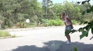 Blonde female Nikki Dream can't hold her pee any longer and squats on roadway on fanspics.com