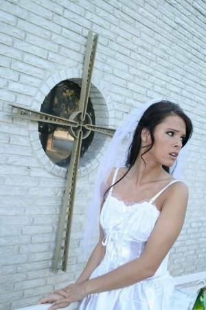 MILF babe in bride's dress Jennifer Dark spreading pussy on fanspics.com