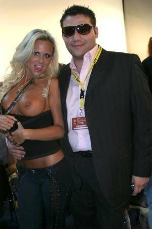 Blonde MILF Silvia Saint fully clothed posing & flaunting big tits at party on fanspics.com
