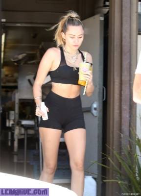  Miley Cyrus Caught In Sport Top And Tight Shorts on fanspics.com