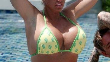 Katie Price Shows Off Her Bikini Body While Relaxing by the Pool with Carl Woods on fanspics.com