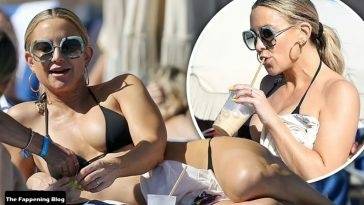 Kate Hudson Stuns in a Black Bikini on the Beach in Miami on fanspics.com