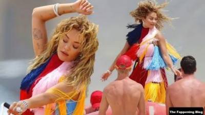 Rita Ora Wears a Bright Dress as She Does a Sexy Shoot at Maroubra Beach on fanspics.com