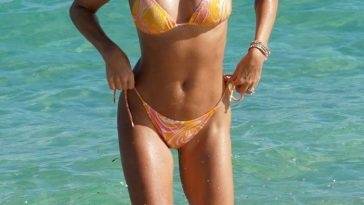 Sylvie Meis Rocks a Skimpy Orange Bikini at the Beach in Miami on fanspics.com