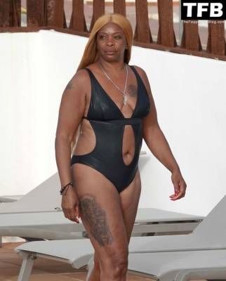 Sandi Bogle Shows Off Her Voluptuous Figure in a Swimsuit Poolside Out in Ibiza on fanspics.com