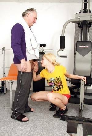 Young fitness chick in pigtails sucks off a much older man's cock on fanspics.com