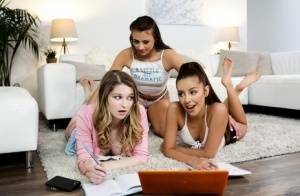 Young girls get busy with a lesbian threesome on a sofa ensemble on fanspics.com