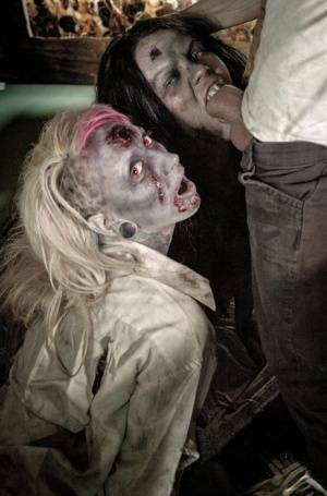 Fetish models Brittany Lynn and Jessie Lee giving head in Zombie threesome on fanspics.com