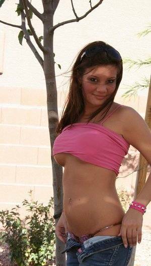 Amateur chick Kate Crush sets her perky tits free outdoors in denim jeans on fanspics.com