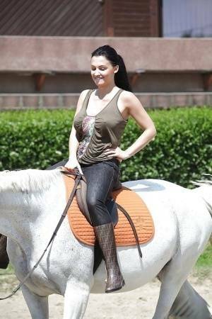 Pornstar Aletta Ocean is riding a horse outdoor in glasses on fanspics.com