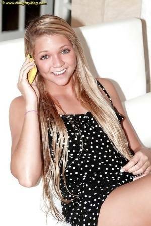 Blonde cutie Jessie Andrews shows it all on her couch. on fanspics.com