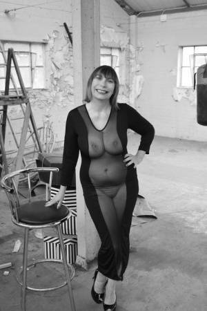 Middle-aged woman Barby Slut models a see-thru dress for a black-and-white gig on fanspics.com