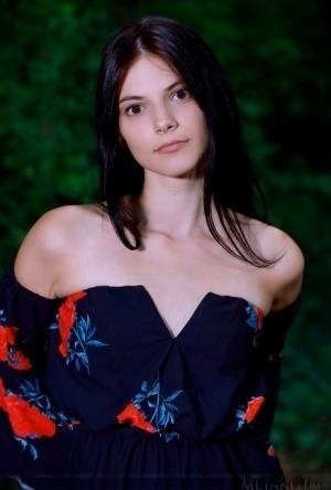 Beautiful teen Aleksandrina gets totally naked while in a forest on fanspics.com