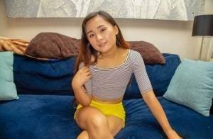 Petite Asian teen Elle Voneva engages in POV sex with a white cock on fanspics.com