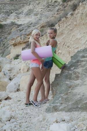 Young hotties Nika N & Milena D head to the hills for lesbian sex on yoga mats on fanspics.com