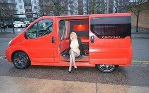 Mature blonde Barby Slut exposes herself inside a camper while in the city on fanspics.com