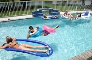 Frolic girls in bikini flashing their tits at the pool party on fanspics.com