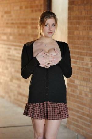 Amateur abbe letting big natural schoolgirl tits loose outdoors in socks on fanspics.com