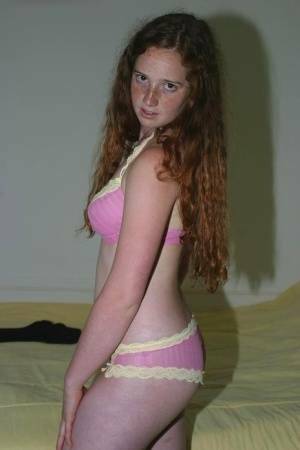 Flexible redhead Rachel showcases her natural pussy after lingerie removal on fanspics.com