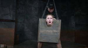 Blonde girl Odette Delacroix is made to suck a black cock with head in stocks on fanspics.com