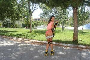 Latina solo girl Carolina Abril shedding shorts to expose nice ass outdoors on fanspics.com